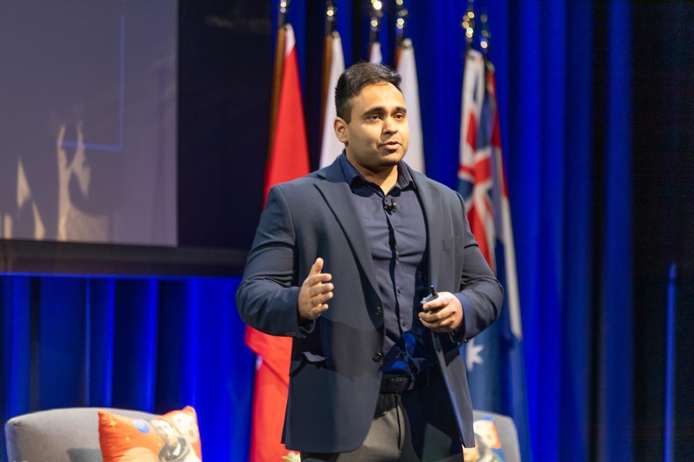 Anmol Taploo giving a talk on air-breathing plasma thrusters at spaceNEXT 2026 in Tysons, Virginia